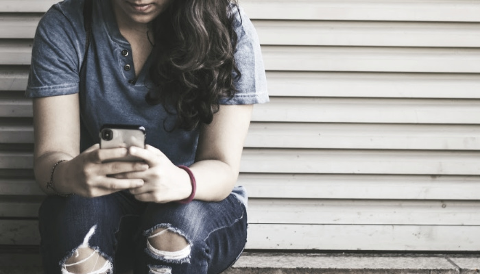 A girl texting.