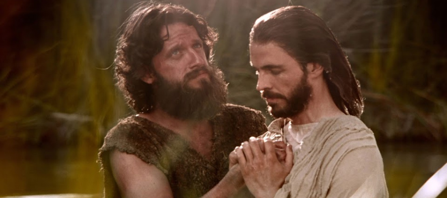 John the Baptist baptizing Jesus.