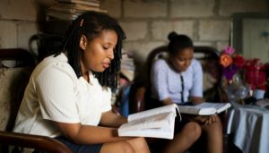 Women reading the scriptures to decide which church to make a long-term commitment to. 