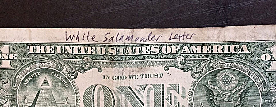 Salamander Letter written on dollar bill.