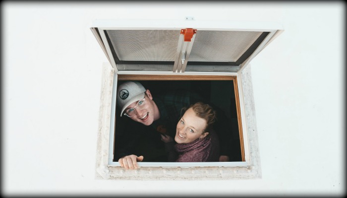 couple in truck bed camper