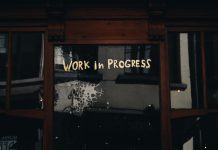 door with writing that says work in progress