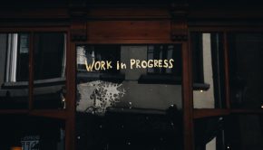 door with writing that says work in progress