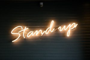 Neon Sign that says Stand Up