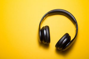 wireless headphones on a yellow background