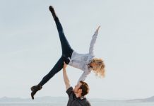 man lifting woman into the air
