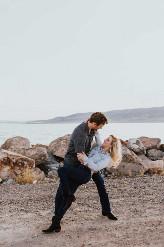 couple dancing next to a lake