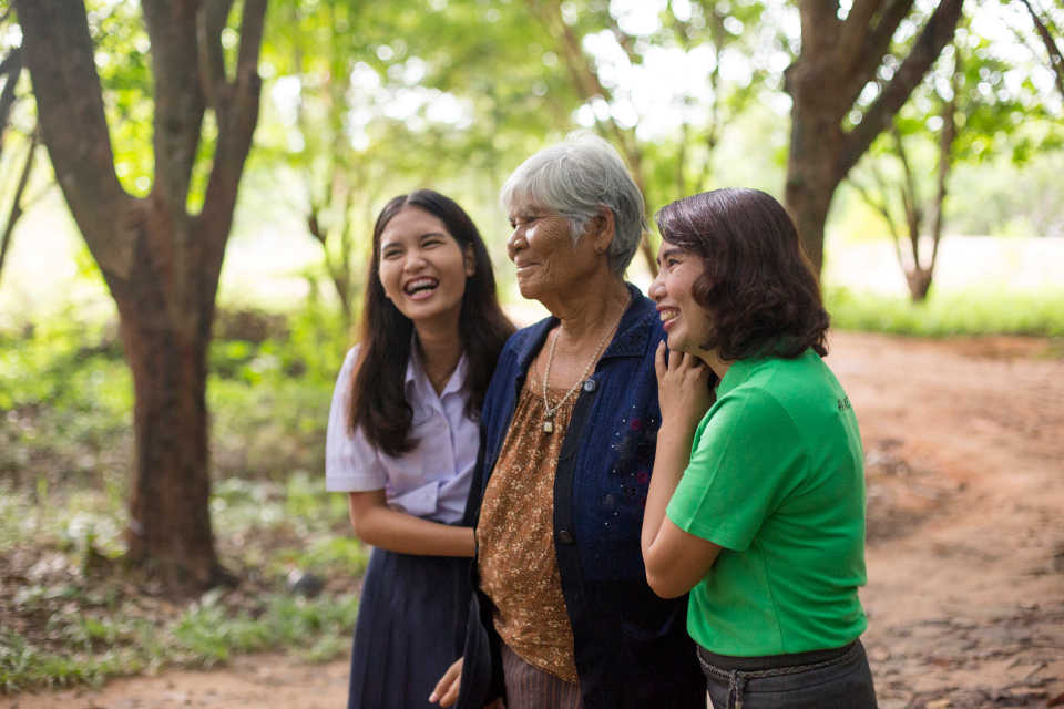 women laughing together after working in the temple