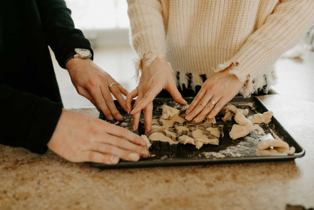 couple baking cookies together in marriage