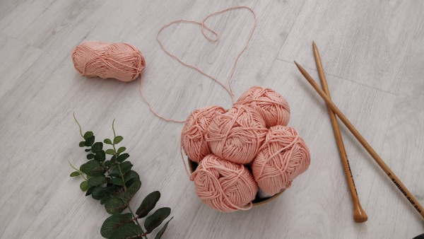 Pink Yarn balls and knitting cables