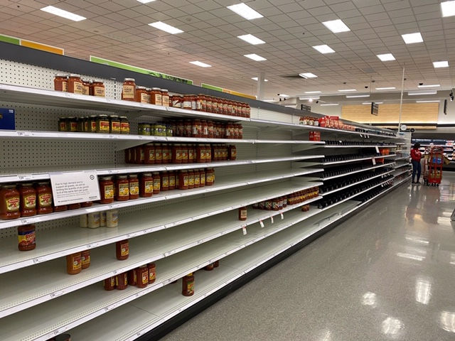 nearly empty pizza sauce shelf