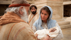 Mary holding the Christ child at presentation to Simeon in the temple. 