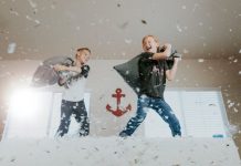 two kids pillow fighting with each other during covid-19