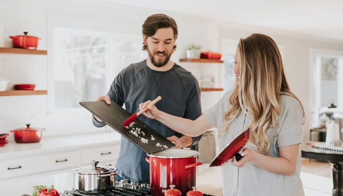 a family cooking together in kitchen