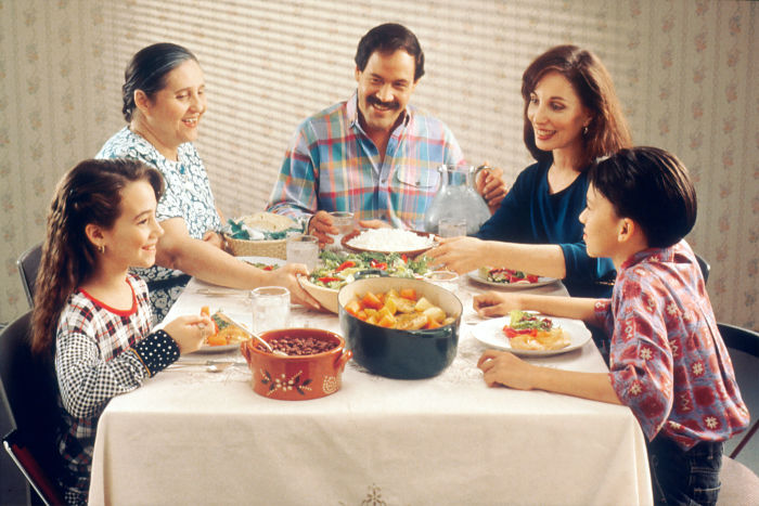 a family eating dinner together at home