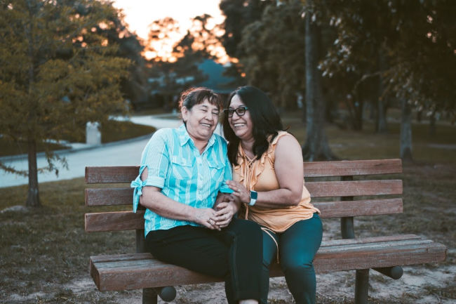 two women laughing together