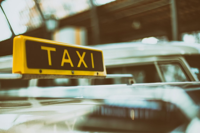 closeup of a taxi sign on a car