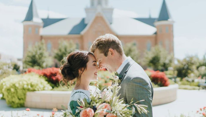 latter-day saint couple wedding outside provo city center temple