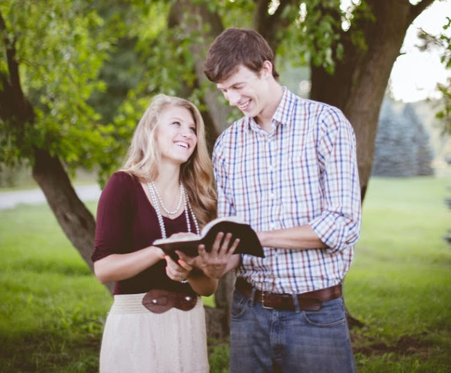 young adults reading scriptures together