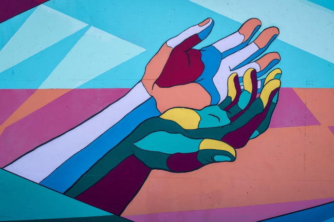 colorful hands together