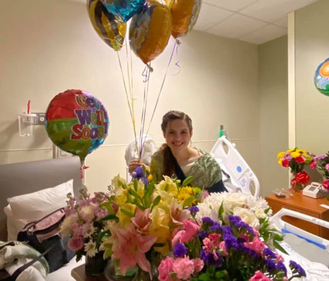 sister lauren willardson in hospital with balloons and flowers