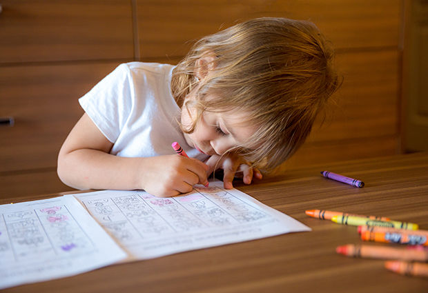 young girl doing activity for general conference