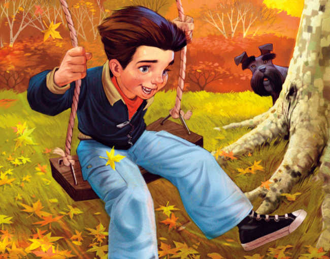 young boy child swings from a tree in autumn