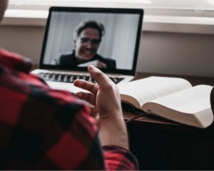 two men video chatting and sharing scriptures