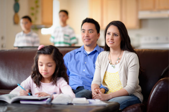 family watching general conference together at home