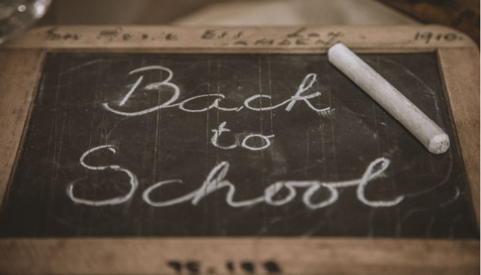 chalkboard that says back to school written on it