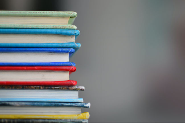 stack of books sitting and have multiple colors