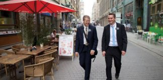 two elder missionaries walking down the street talking