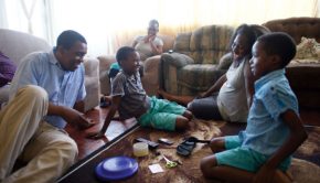 family from south africa playing a game together for family home evening