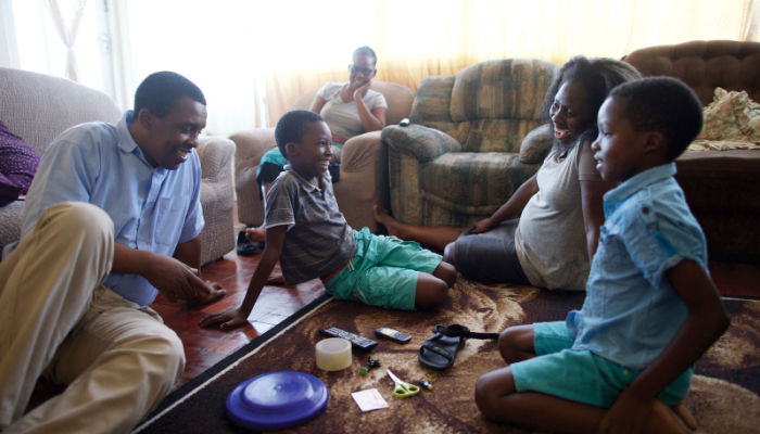 family from south africa playing a game together for family home evening