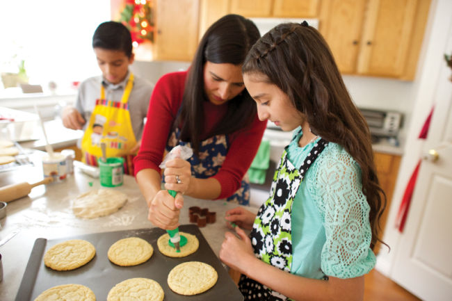 family frosting cookies for christmas and #LightTheWorld