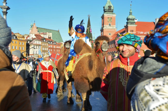 three kings day being celebrated with men riding camels