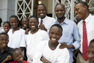 A group of people prepare to be baptized by proper priesthood authority in the Congo.