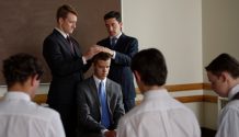 A young man is ordained to an office in the Aaronic priesthood.