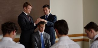 A young man is ordained to an office in the Aaronic priesthood.